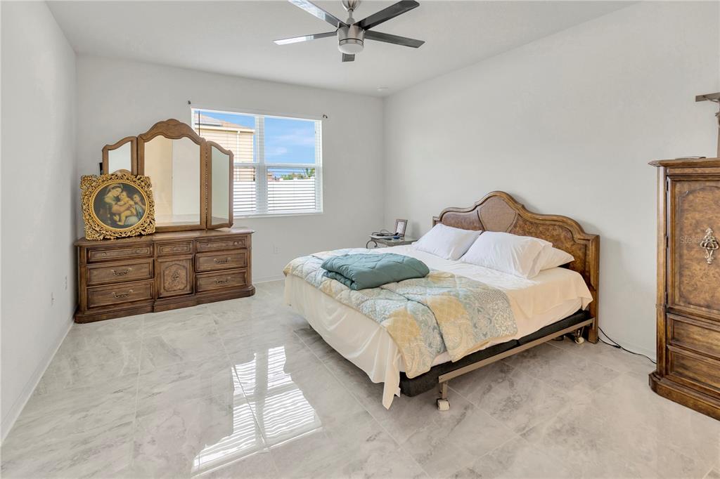 11530 Brighton Knoll Loop Riverview, FL 33579 - Photo 21 of 64 a bedroom with a bed and window