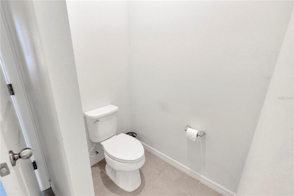 11530 Brighton Knoll Loop Riverview, FL 33579 - Photo 25 of 64 a white toilet sitting next to a white wall