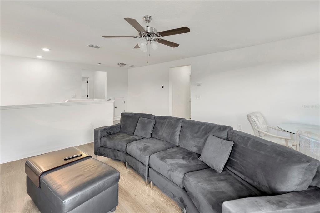 11530 Brighton Knoll Loop Riverview, FL 33579 - Photo 28 of 64 a living room with furniture and a ceiling fan