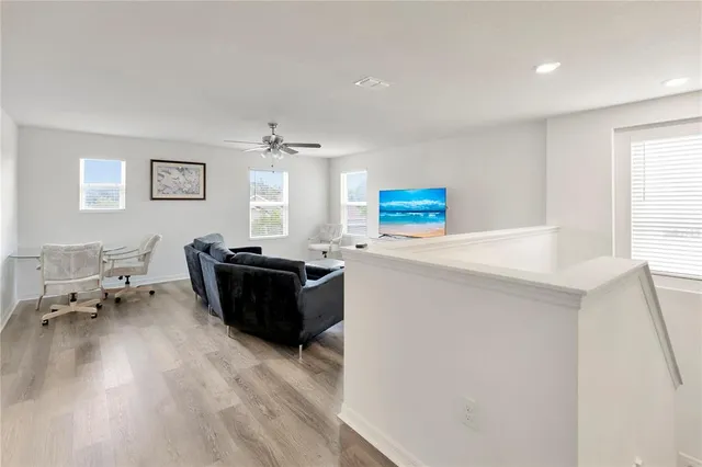 a bathroom with a granite countertop sink a toilet and a mirror
