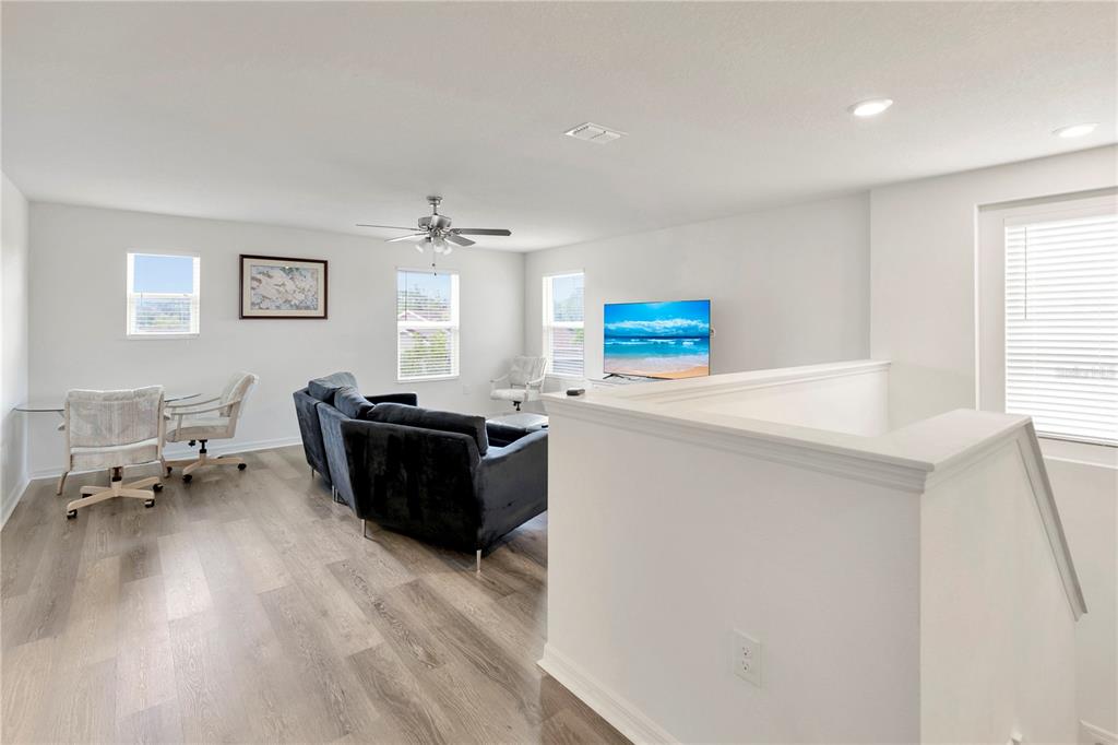 11530 Brighton Knoll Loop Riverview, FL 33579 - Photo 30 of 64 a living room with furniture and a table