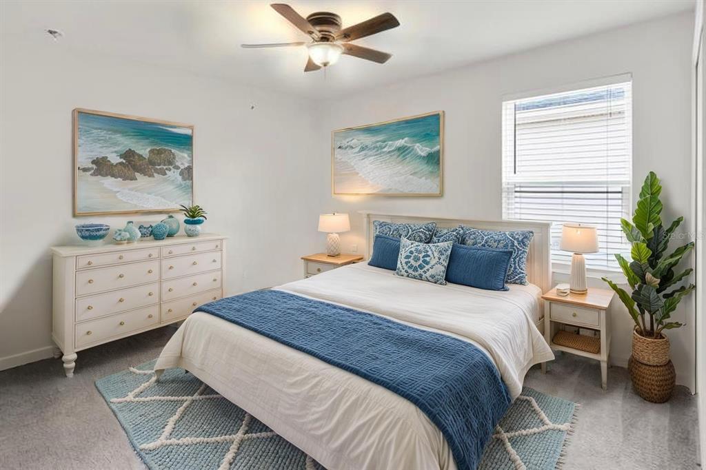 11530 Brighton Knoll Loop Riverview, FL 33579 - Photo 37 of 64 a bedroom with a bed and a painting on the wall