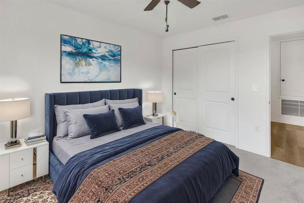 11530 Brighton Knoll Loop Riverview, FL 33579 - Photo 42 of 64 a bedroom with bed and painting on the wall