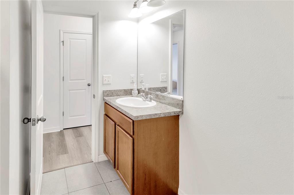 11530 Brighton Knoll Loop Riverview, FL 33579 - Photo 44 of 64 a bathroom with a sink and a mirror