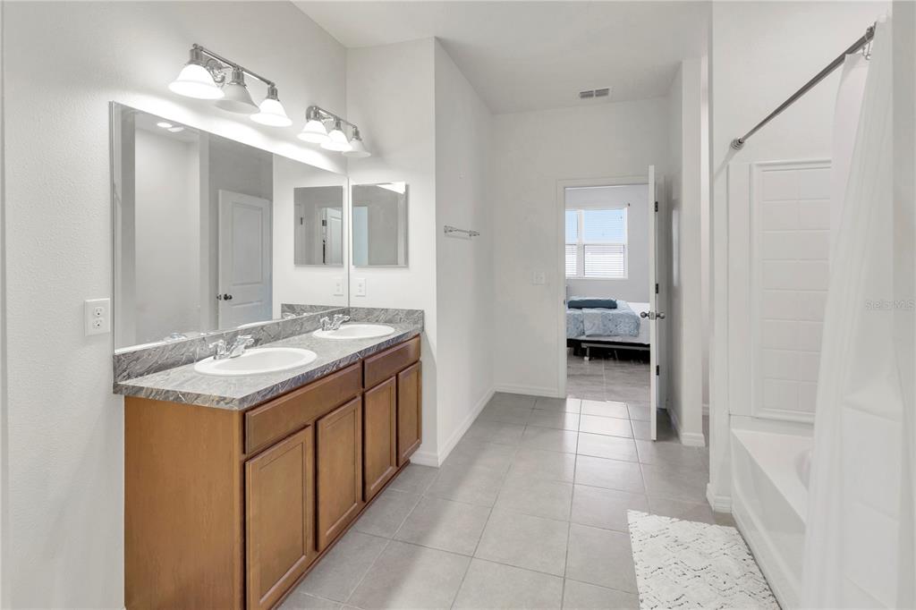 11530 Brighton Knoll Loop Riverview, FL 33579 - Photo 46 of 64 a bathroom with a sink and a mirror