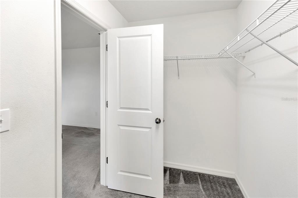 11530 Brighton Knoll Loop Riverview, FL 33579 - Photo 48 of 64 a view of walk in closet with empty racks