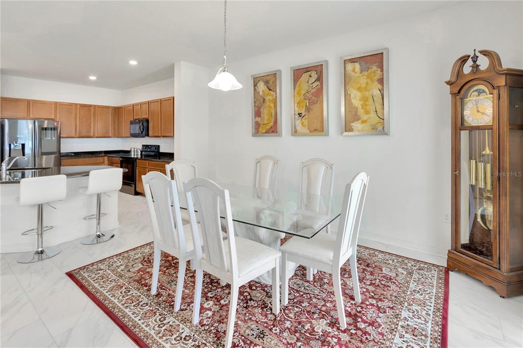 11530 Brighton Knoll Loop Riverview, FL 33579 - Photo 5 of 64 a view of a dining room with furniture