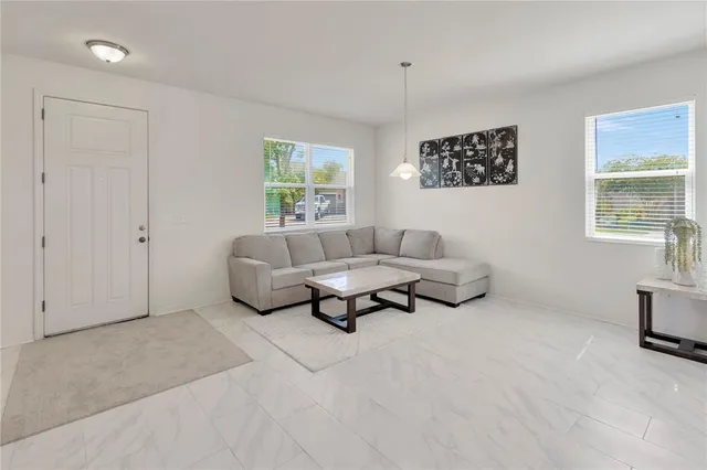 a living room with furniture and a window