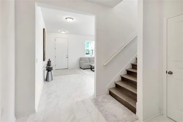 a kitchen with stainless steel appliances kitchen island granite countertop a sink and cabinets