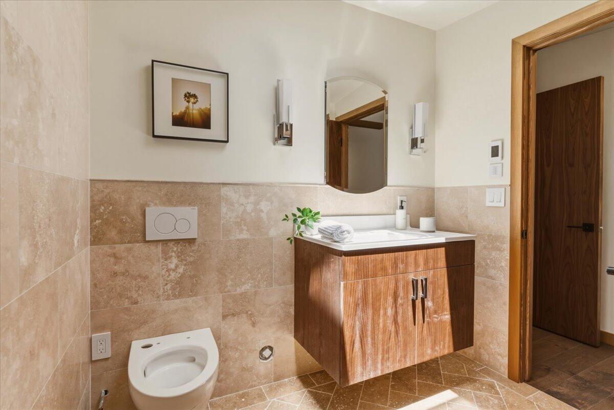 151 Kinman Avenue Goleta, CA 93117 - Photo 13 of 20 a bathroom with a sink a toilet and shower