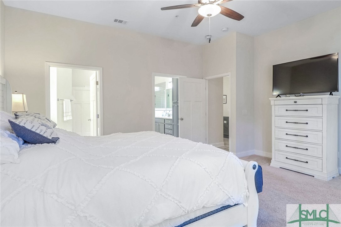 1201 Woodside Ridge Savannah, GA 31405 - Photo 11 of 27 Luxurious primary suite with expansive wardrobe sp