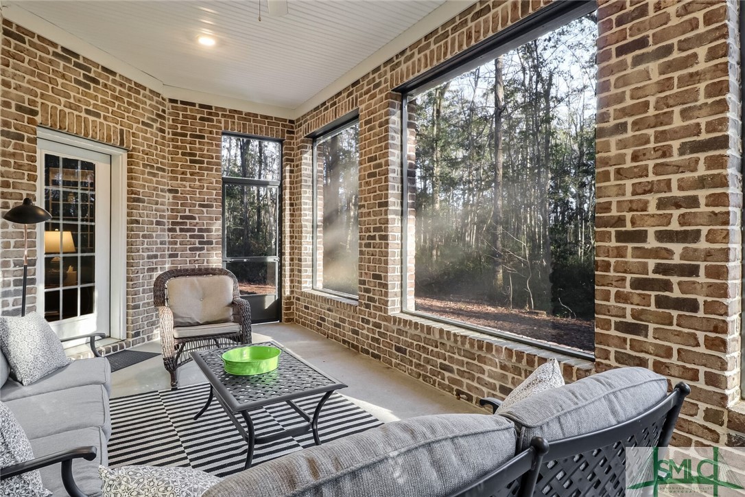 1201 Woodside Ridge Savannah, GA 31405 - Photo 19 of 27 Serene screened patio with wooded views