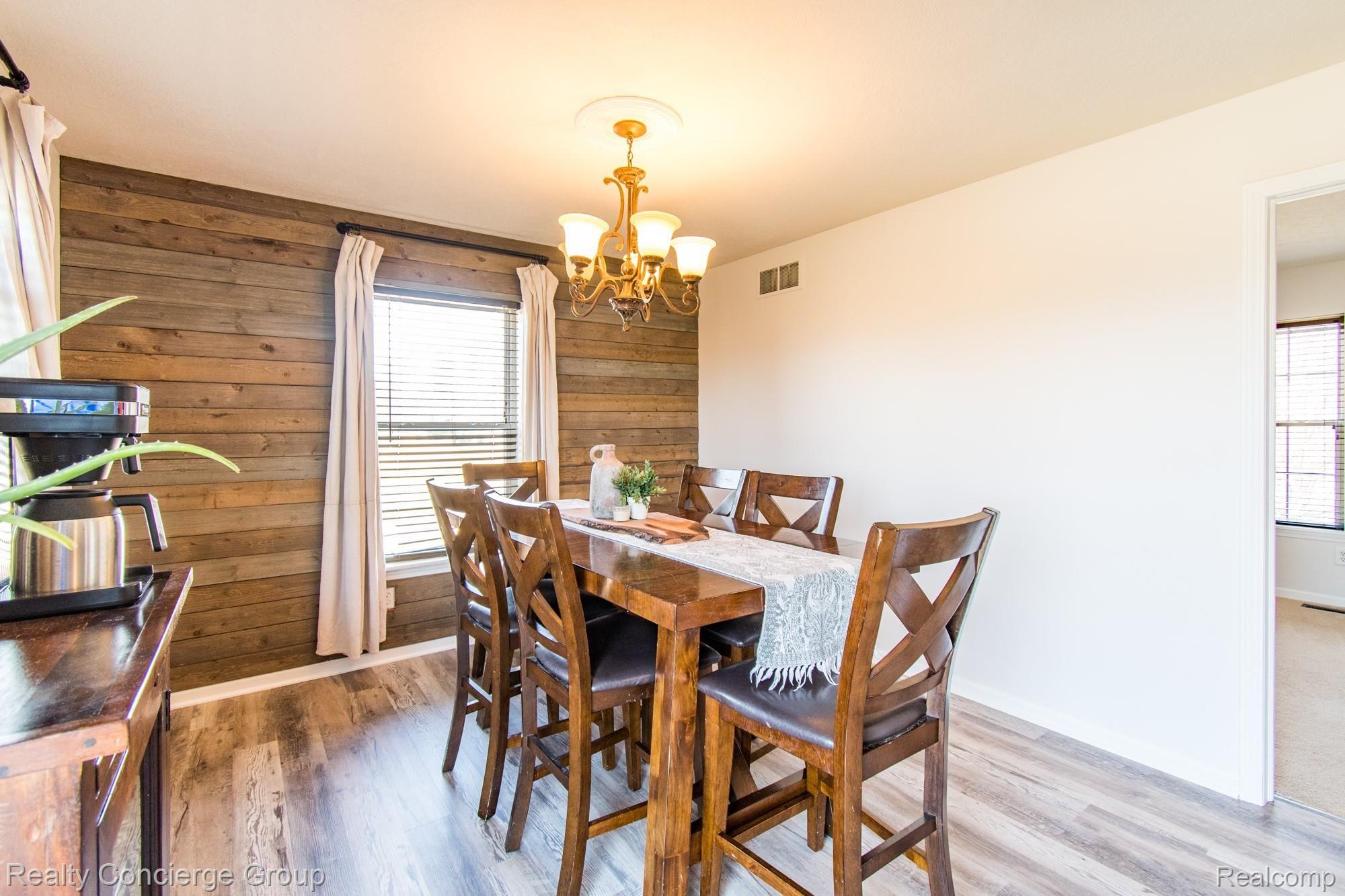 601 North Kane Road Webberville, MI 48892 - Photo 5 of 36 Gorgeous accent wall shines in the dining area