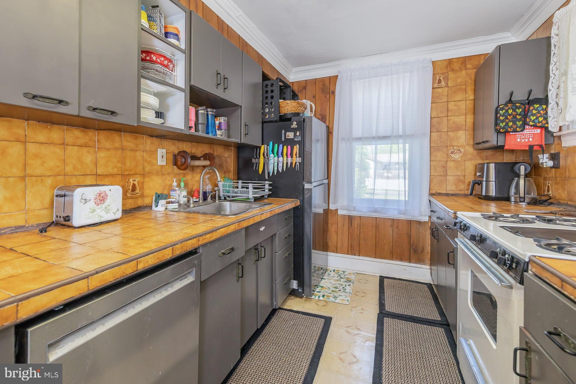 401 West Avenue Delanco, NJ 08075 - Photo 5 of 19 a kitchen with stainless steel appliances granite countertop a sink and a stove