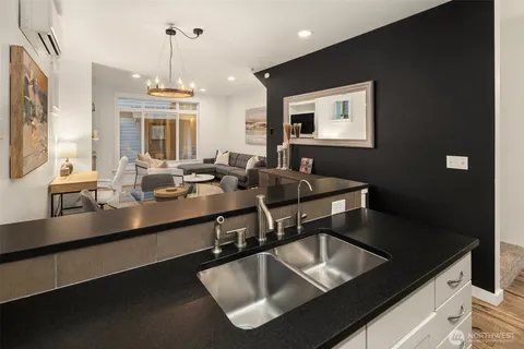 a kitchen with a sink and a refrigerator