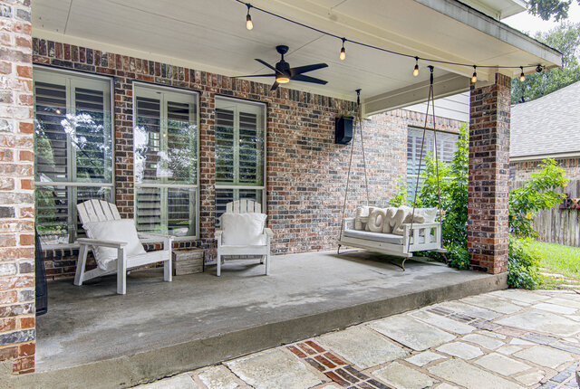 507 Rummel Ranch Run Cedar Park, TX 78613 - Photo 8 of 39 An inviting covered patio offers a charming porch swing and ample space for relaxation.