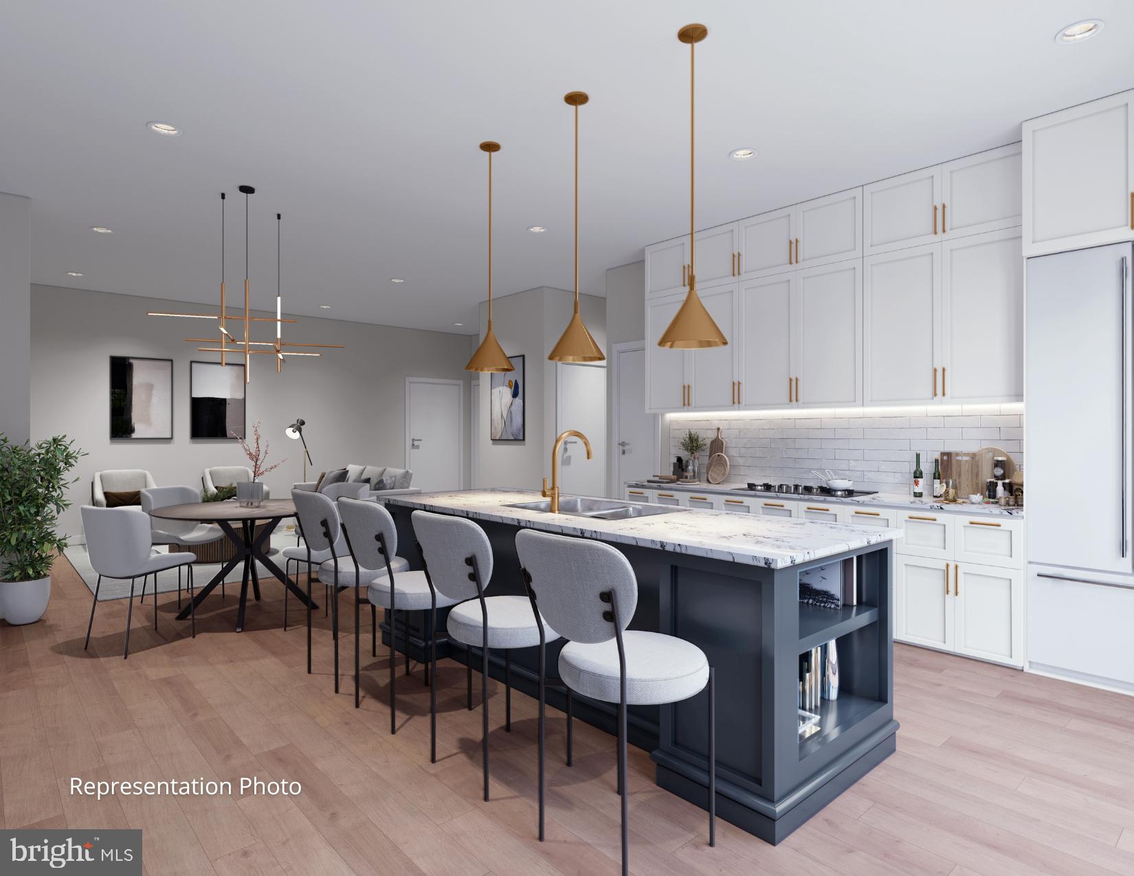 117 Blackford Boulevard, Unit 301 Lebanon, PA 17042 - Photo 5 of 6 a kitchen with kitchen island granite countertop a sink a center island a stove and a living room view