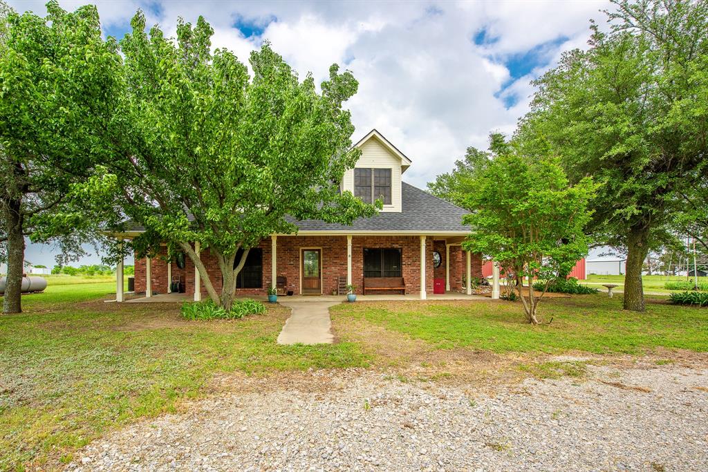 2900 Ripy Road Krum, TX 76249 - Photo 1 of 1 a front view of a house with a yard and trees