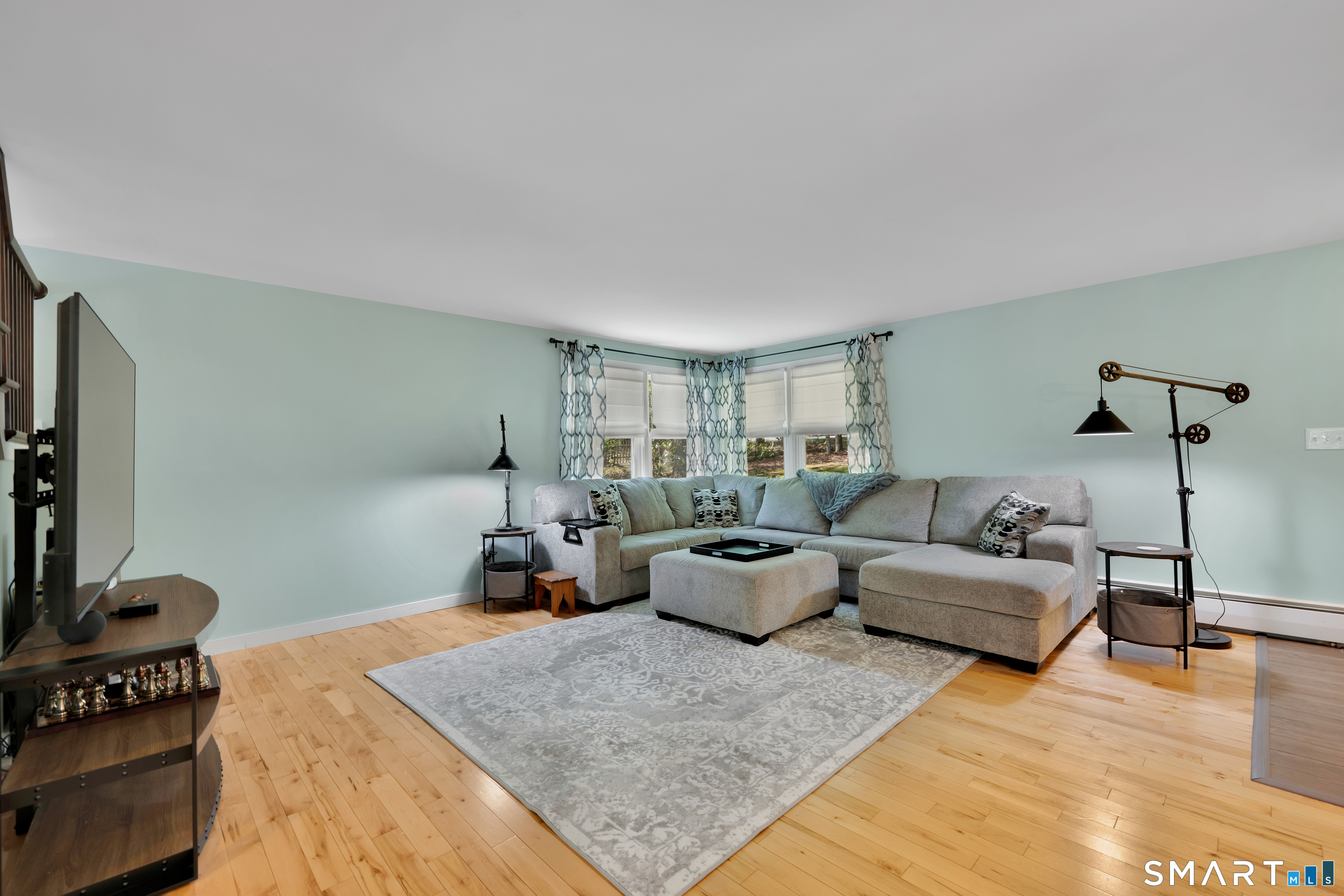 116 Canton Road Granby, CT 06035 - Photo 13 of 29 a living room with furniture and a flat screen tv