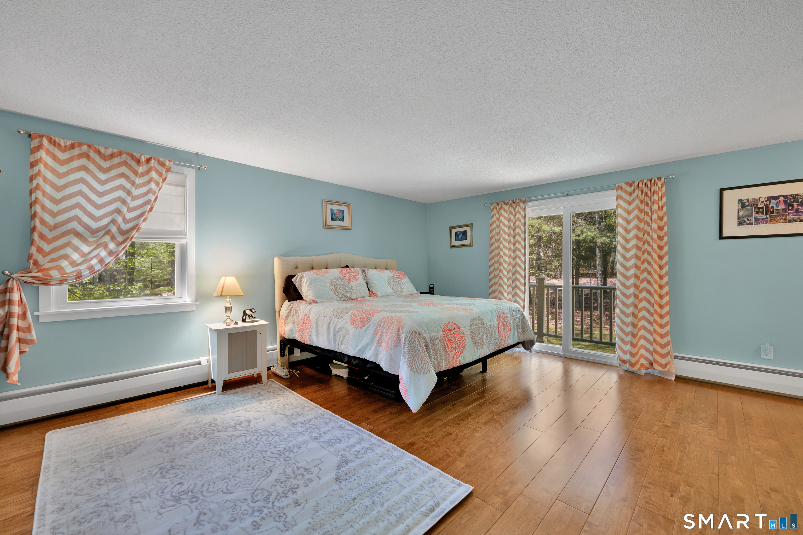 116 Canton Road Granby, CT 06035 - Photo 16 of 29 a bed sitting in a spacious bedroom next to a window