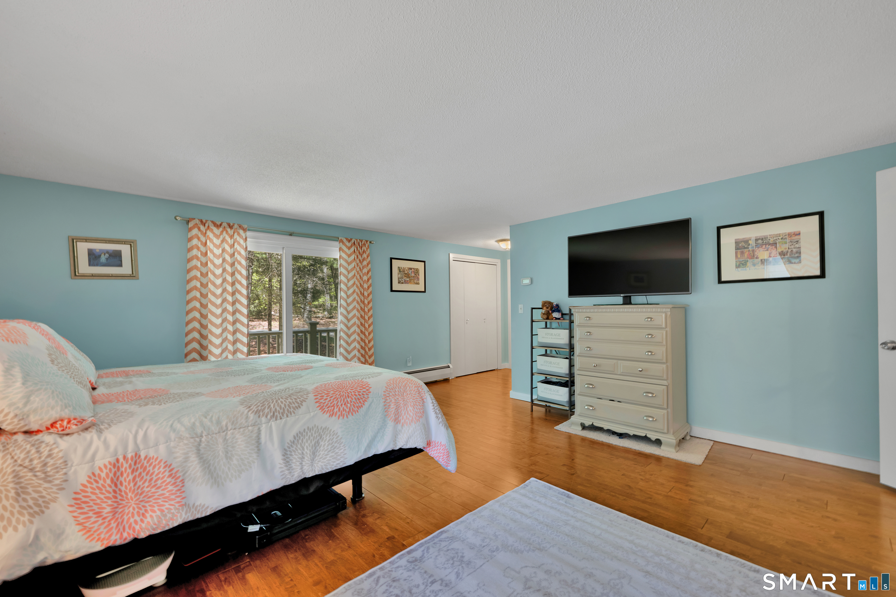 116 Canton Road Granby, CT 06035 - Photo 18 of 29 a bedroom with a bed and a flat screen tv