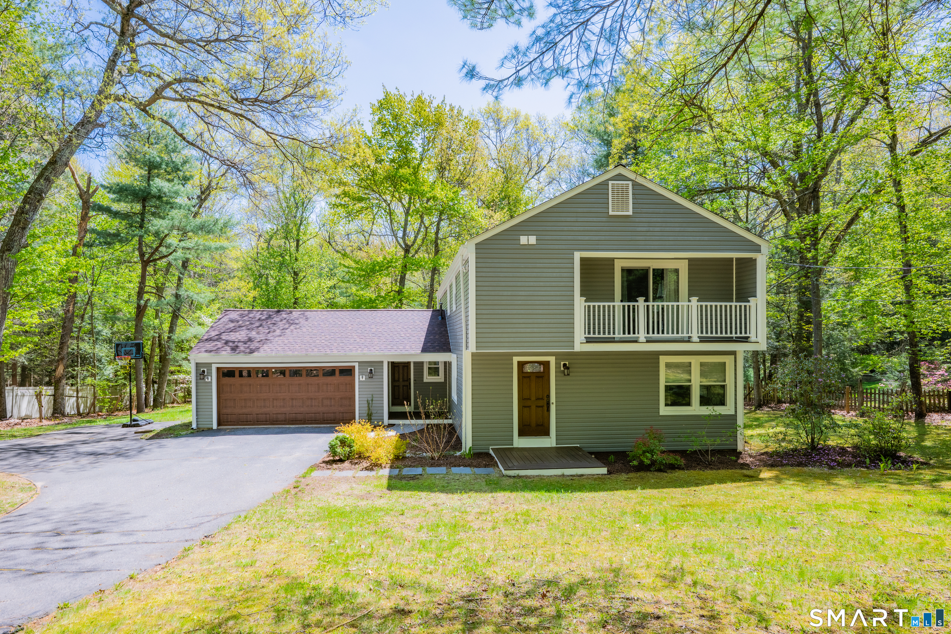 116 Canton Road Granby, CT 06035 - Photo 2 of 29 a front view of a house with a yard and trees