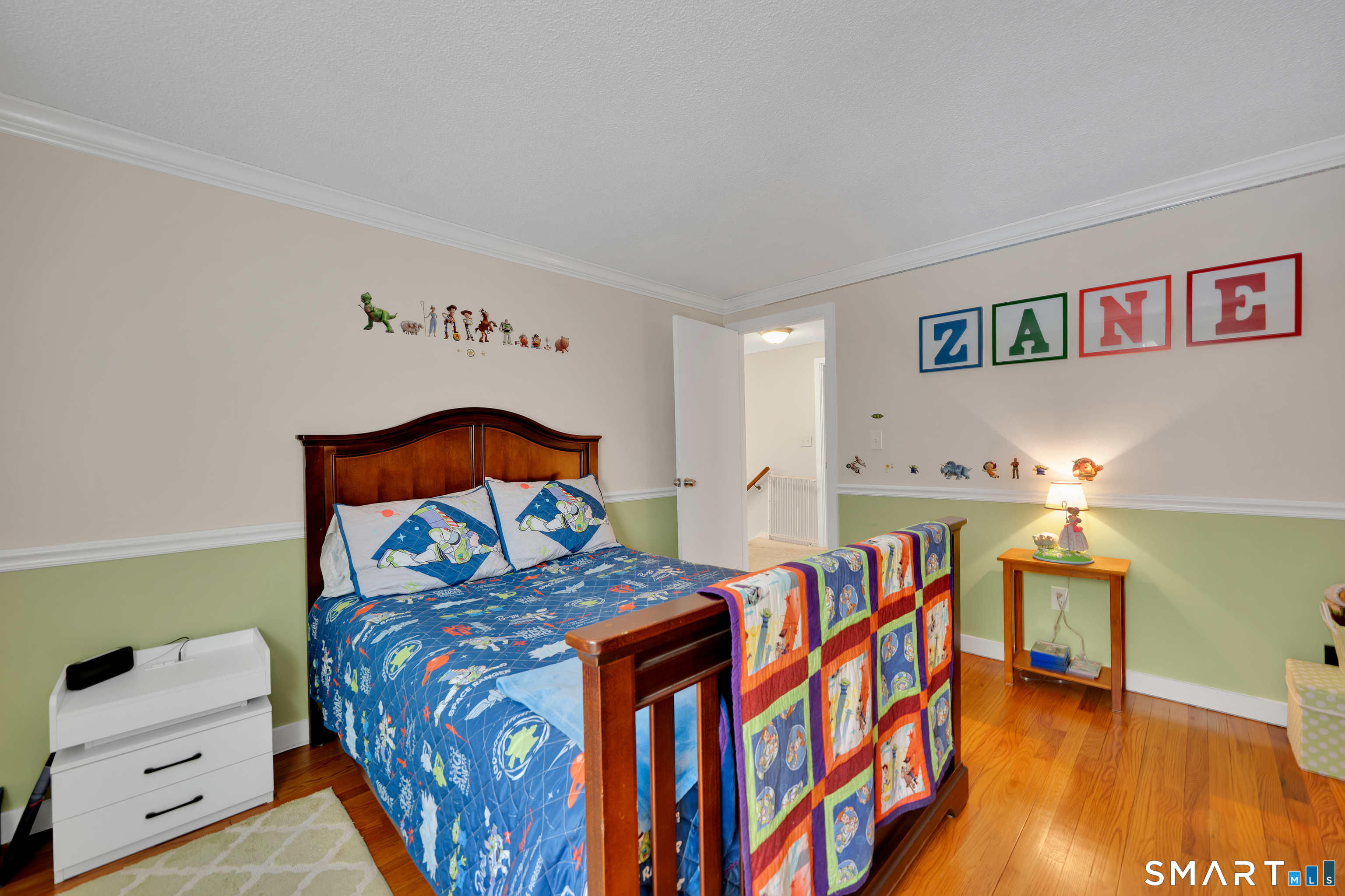 116 Canton Road Granby, CT 06035 - Photo 21 of 29 a bedroom with furniture and a wooden floor