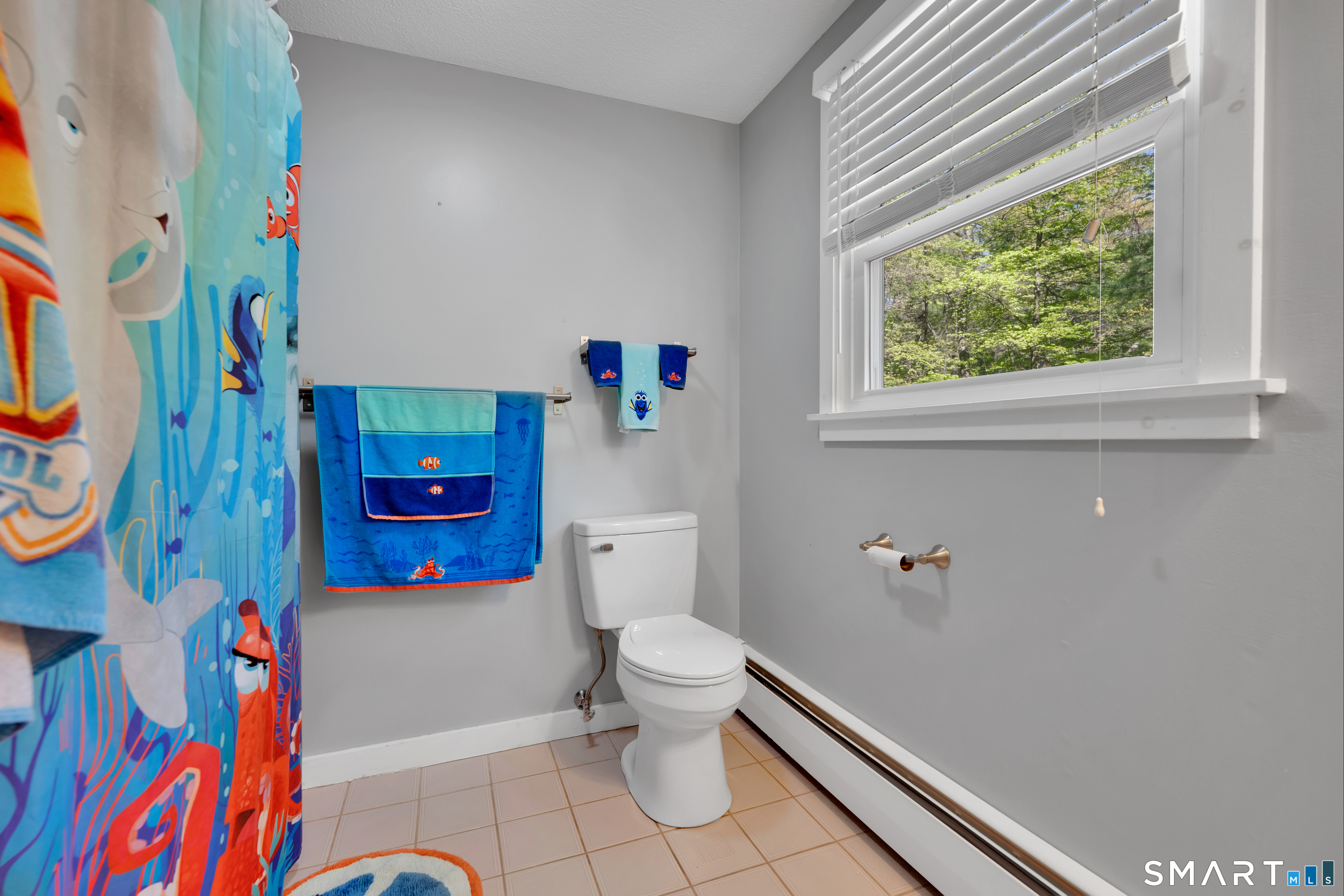 116 Canton Road Granby, CT 06035 - Photo 22 of 29 a bathroom with a toilet and a shower curtain