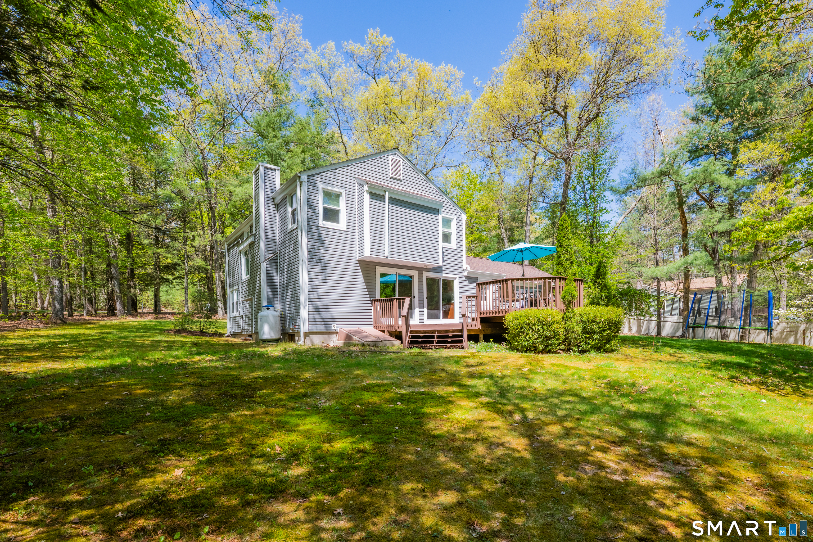 116 Canton Road Granby, CT 06035 - Photo 4 of 29 a view of a house with a big yard and large trees