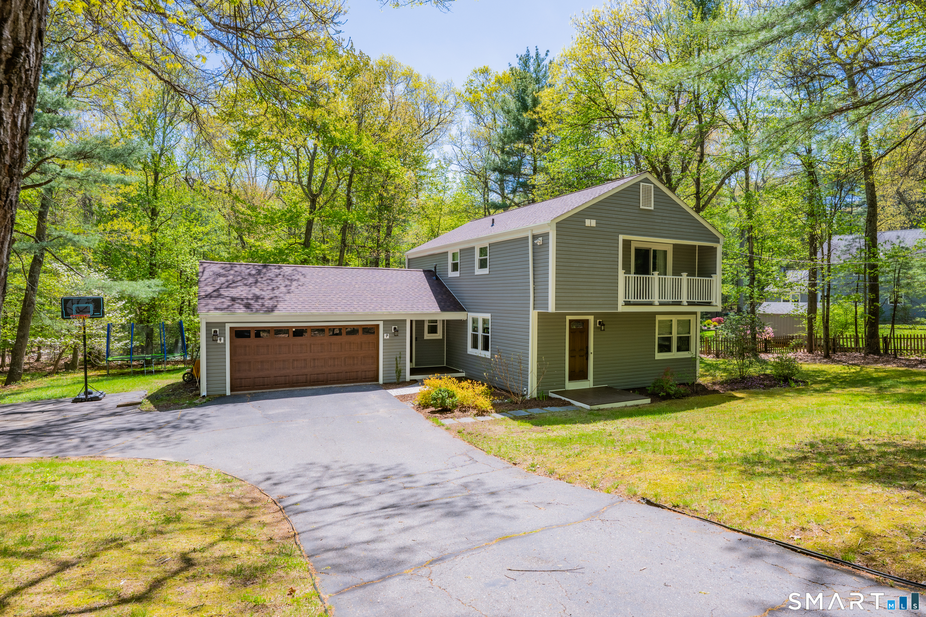 116 Canton Road Granby, CT 06035 - Photo 5 of 29 a view of a house with backyard outdoor seating and covered with trees