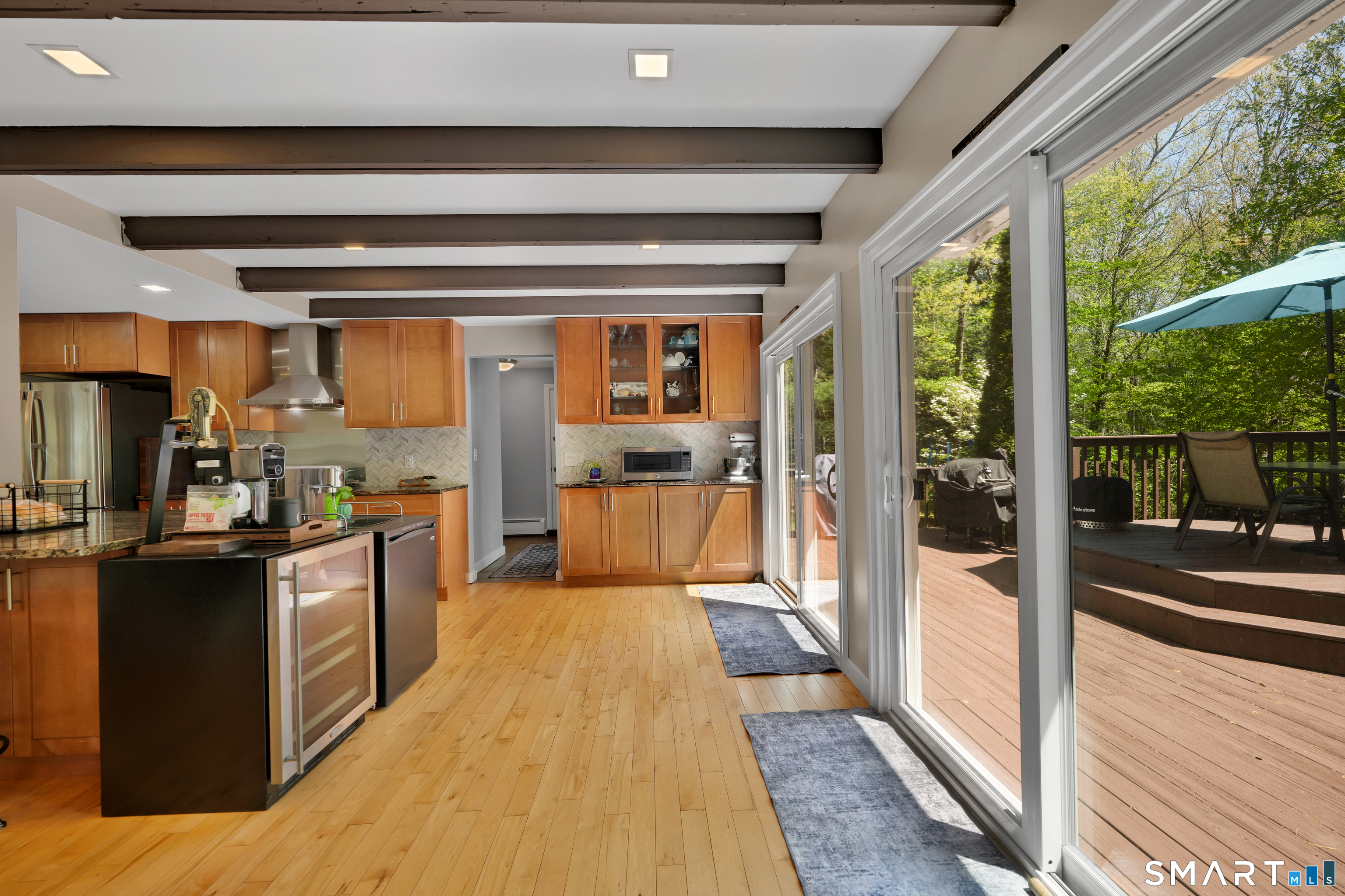 116 Canton Road Granby, CT 06035 - Photo 7 of 29 a large kitchen with stainless steel appliances wooden floor and large window