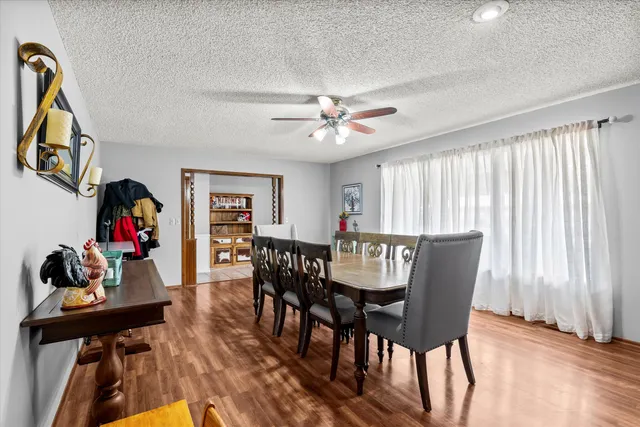 a view of a livingroom with furniture and wooden floor