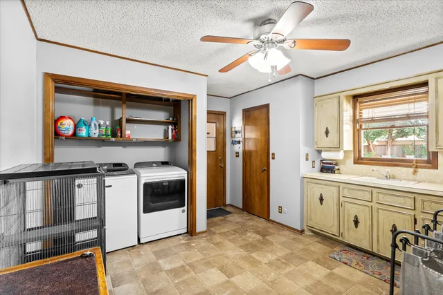 a view of a bedroom with closet and windows