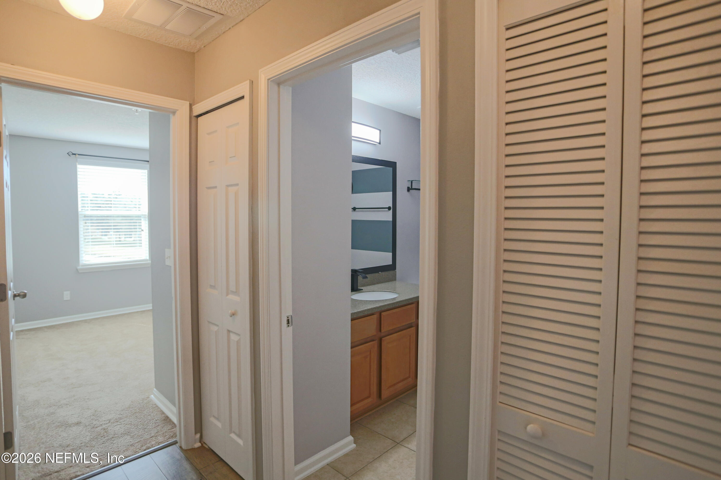 904 Golden Lake Loop St. Augustine, FL 32084 - Photo 18 of 43 Hall to bathroom