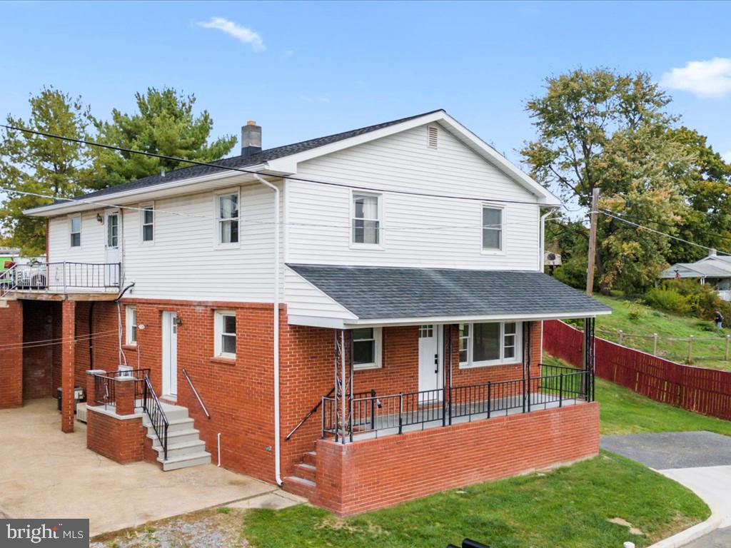1310 Delaware Lane, Unit A Hagerstown, MD 21740 - Photo 23 of 24 a front view of a house with garden