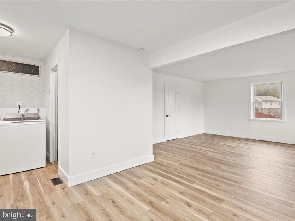 1310 Delaware Lane, Unit A Hagerstown, MD 21740 - Photo 9 of 24 a view of empty room with wooden floor