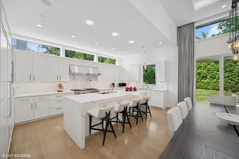 a kitchen with a table and chairs in it