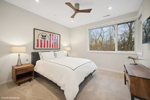 a bedroom with a bed and a table