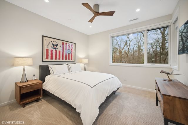 a bedroom with a bed and a table