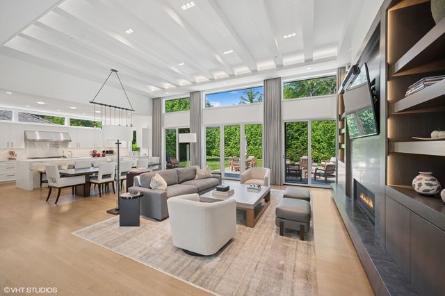 a very nice looking living room with a large window and stuff