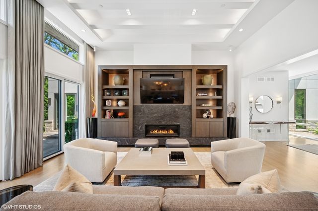 a living room with furniture and large window