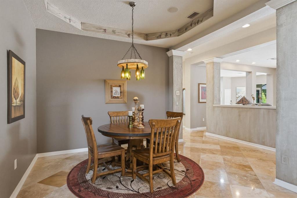 9103 Creedmoor Lane New Port Richey, FL 34654 - Photo 13 of 90 a view of a dining room with furniture