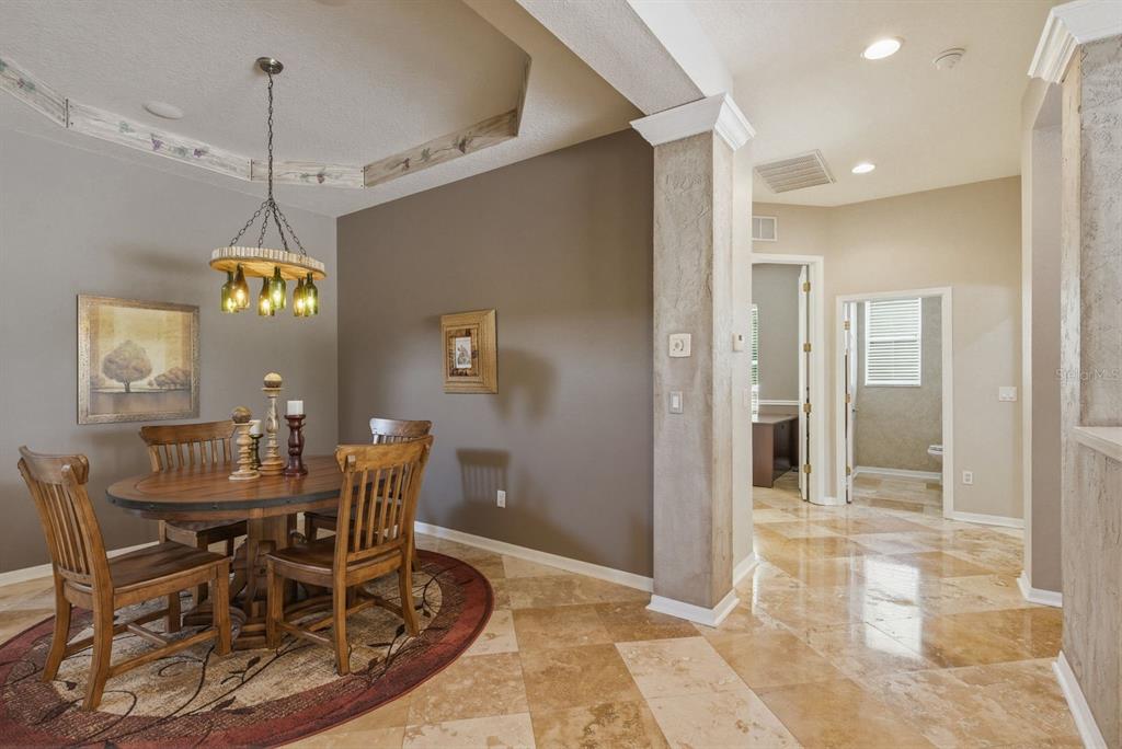 9103 Creedmoor Lane New Port Richey, FL 34654 - Photo 15 of 90 a view of a dining room with furniture