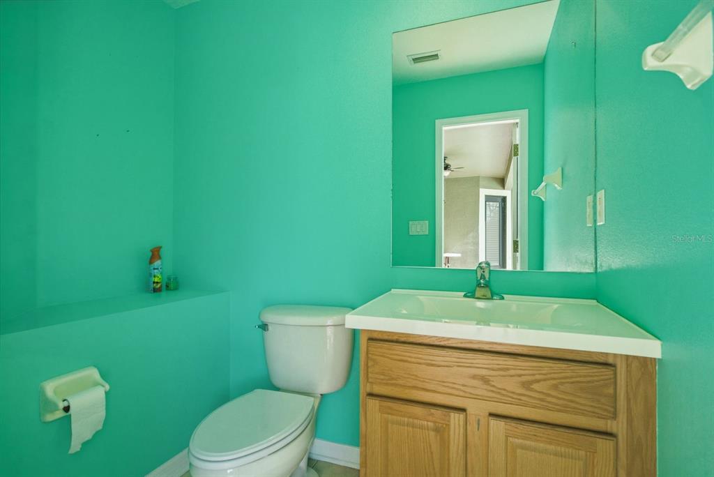 9103 Creedmoor Lane New Port Richey, FL 34654 - Photo 54 of 90 a bathroom with a sink and a mirror