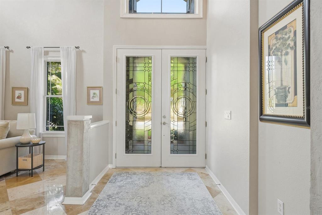 9103 Creedmoor Lane New Port Richey, FL 34654 - Photo 6 of 90 a view of an entryway with wooden floor and a livingroom