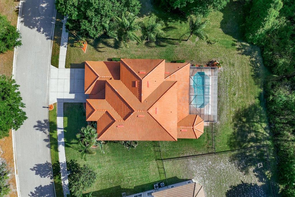 9103 Creedmoor Lane New Port Richey, FL 34654 - Photo 73 of 90 an aerial view of a house with a yard basket ball court and outdoor seating