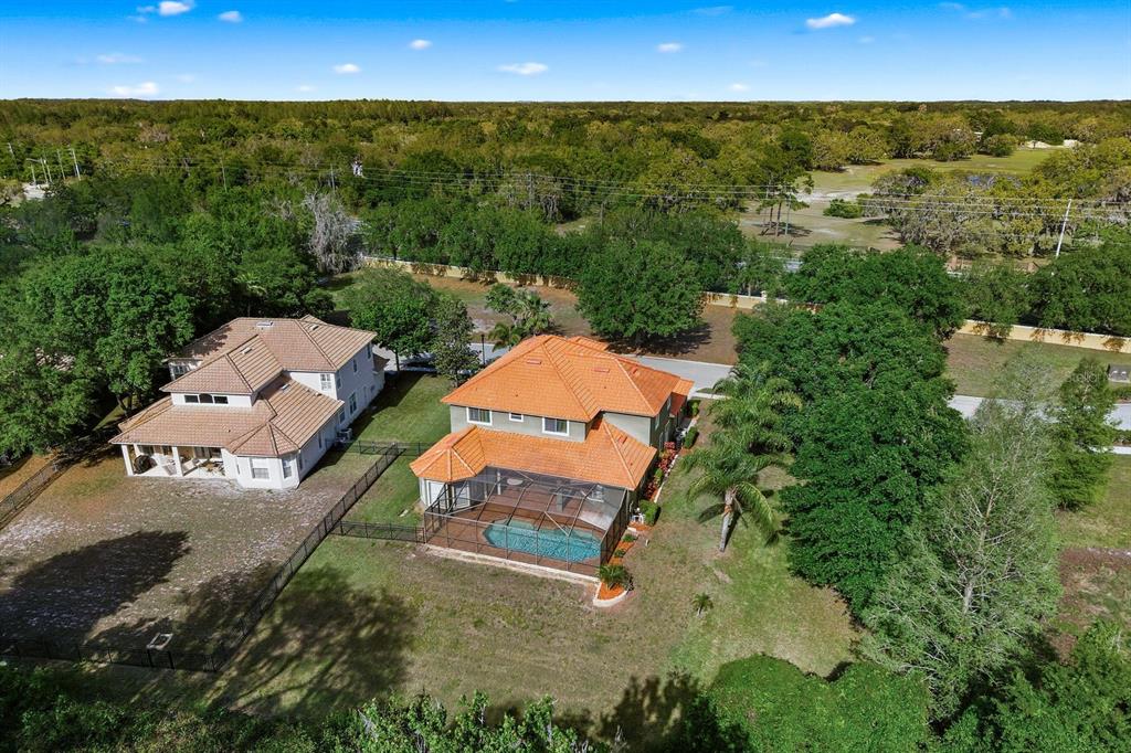 9103 Creedmoor Lane New Port Richey, FL 34654 - Photo 75 of 90 an aerial view of a house with a yard