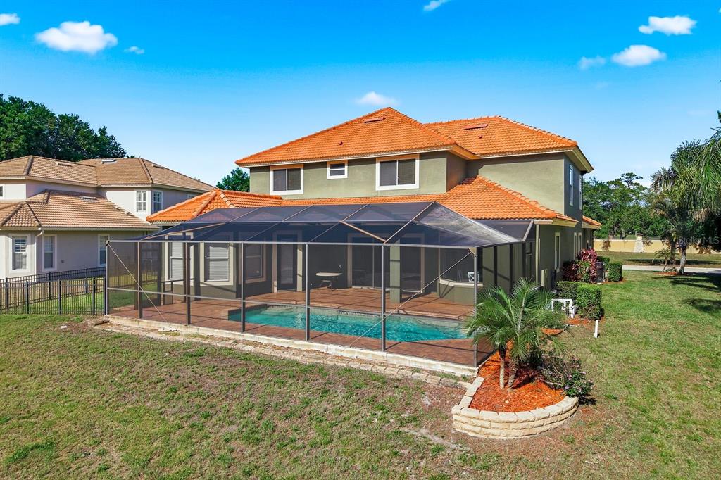 9103 Creedmoor Lane New Port Richey, FL 34654 - Photo 76 of 90 a front view of a house with a yard