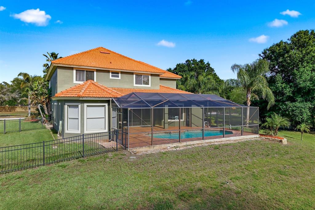 9103 Creedmoor Lane New Port Richey, FL 34654 - Photo 78 of 90 a front view of a house with a yard