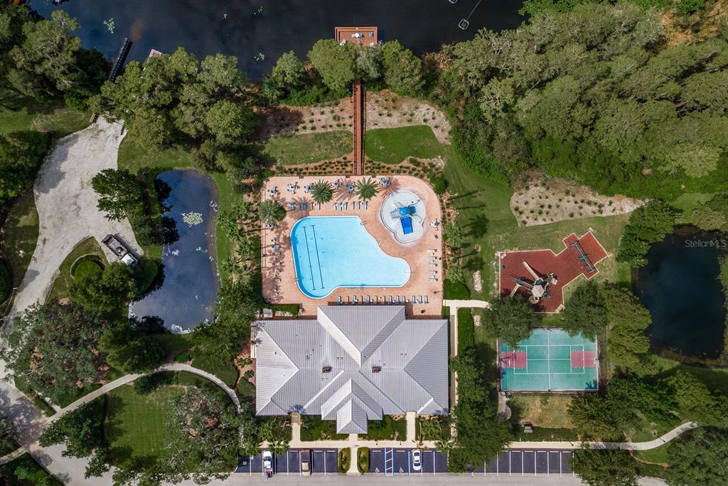 9103 Creedmoor Lane New Port Richey, FL 34654 - Photo 86 of 90 an aerial view of residential houses with outdoor space and parking